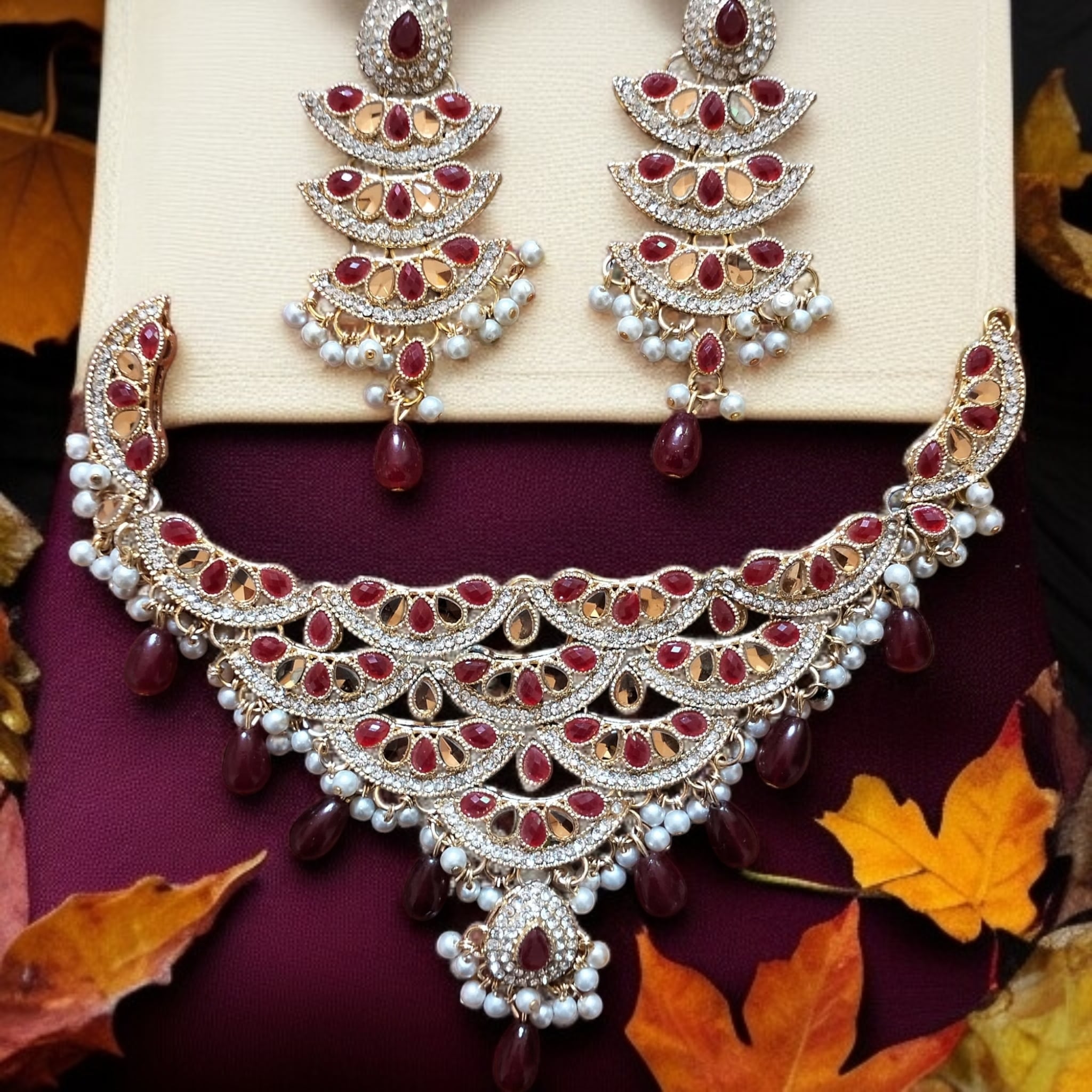 Buy Red and Golden colour jewellery set with necklace and earrings at best price in Pakistan