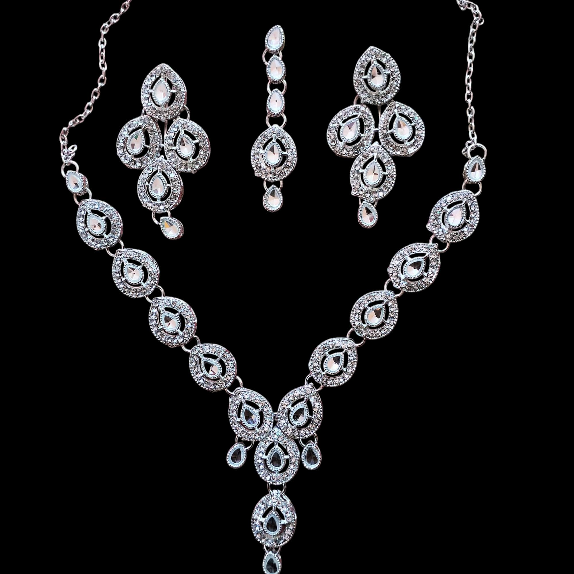 Buy White colour jewellery set with necklace , earrings and tikka at best price in Pakistan